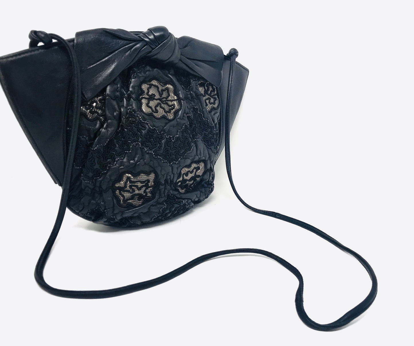 1980s black lambskin crossbody with lacework detail and bow accent