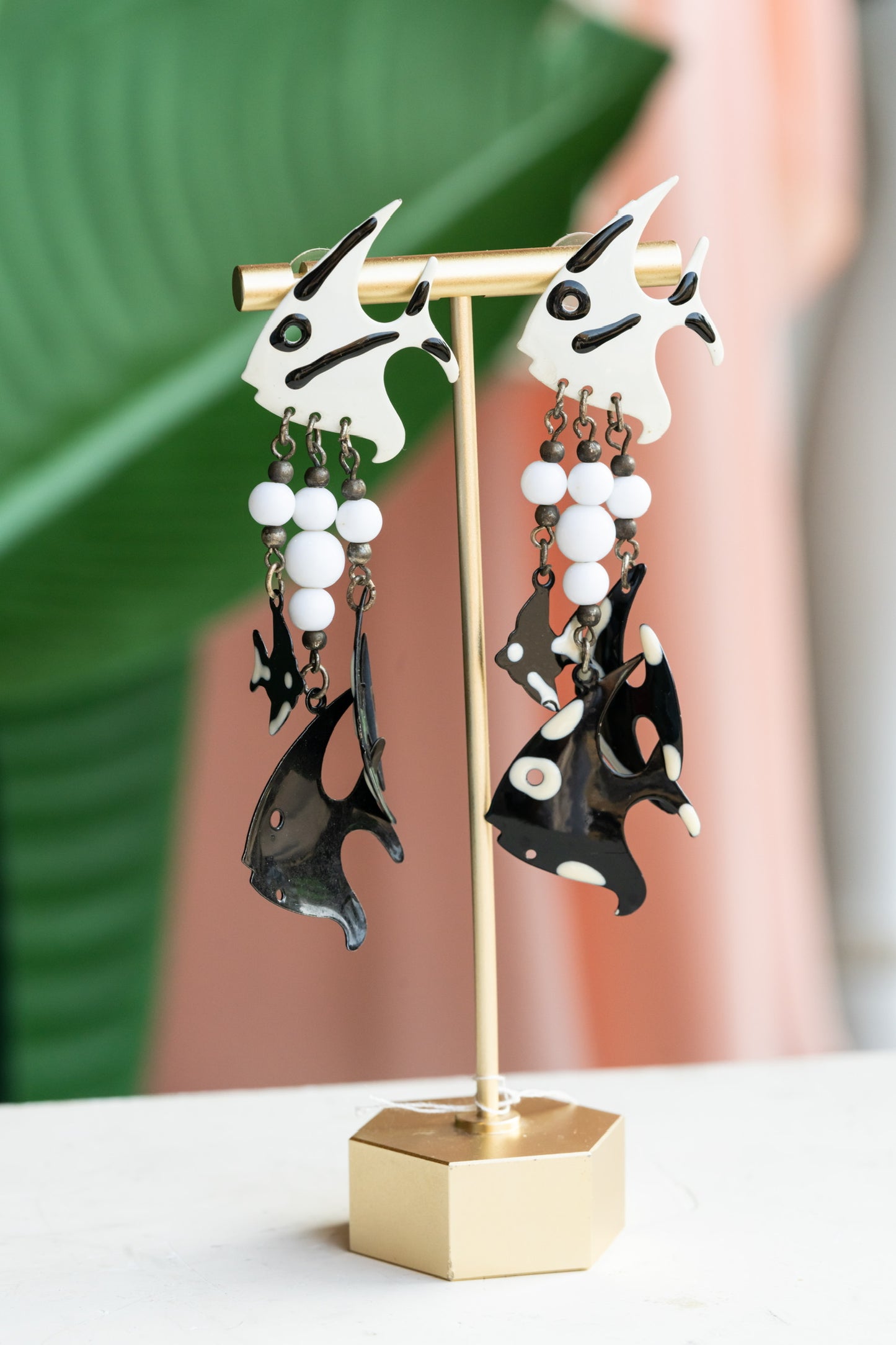 1980s black and white painted metal and bead fish earrings